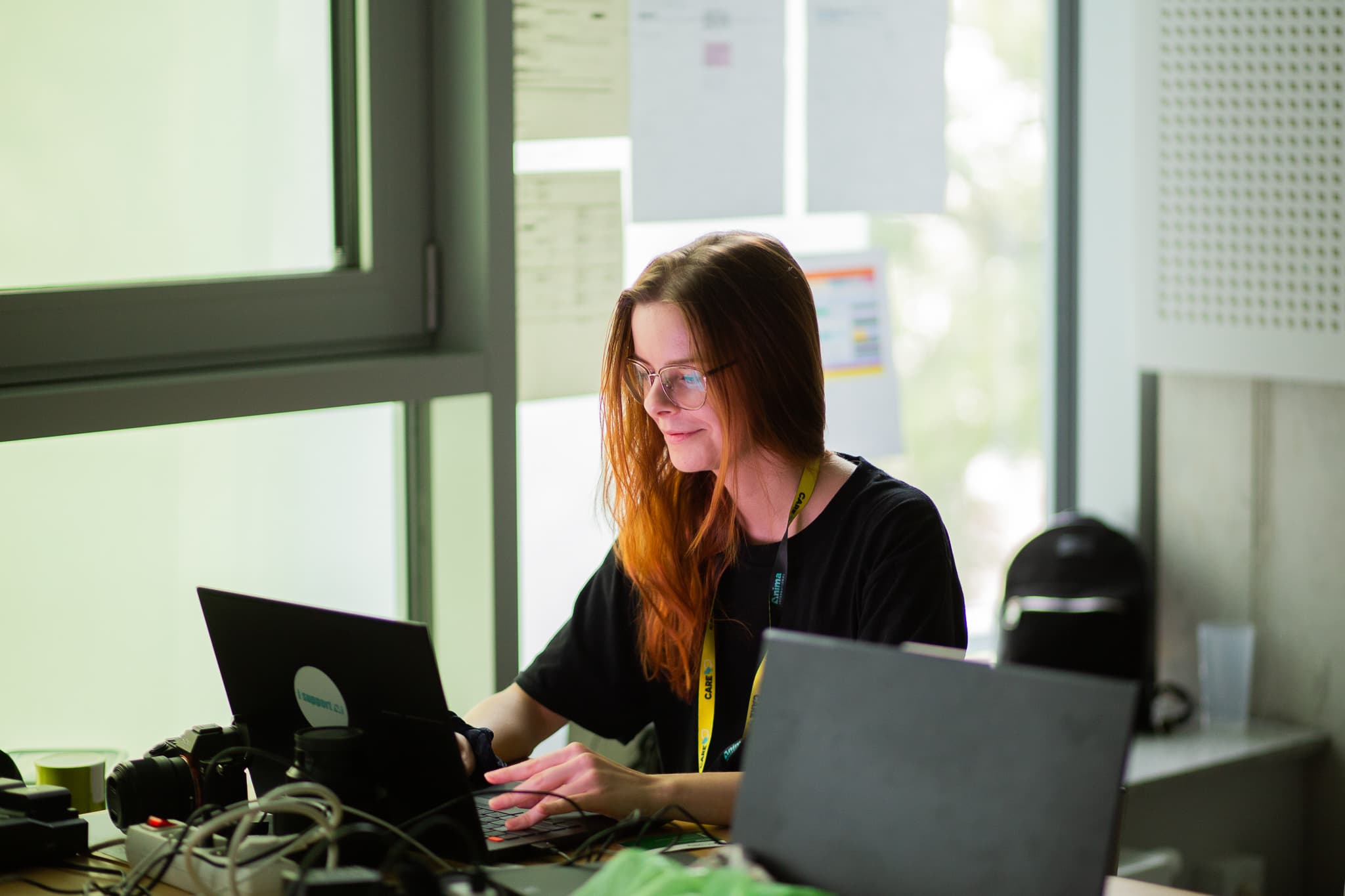 A young female activist working at a laptop
