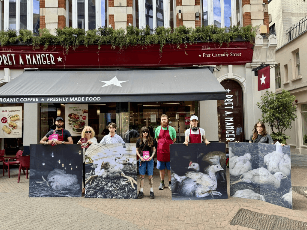 Anima activists holding signs outside Pret on Carnaby Street in London